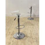 A pair of contemporary chrome and moulded acrylic rise and fall swivel bar stools, H85cm