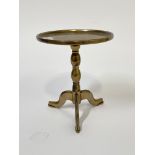 A miniature Georgian cast brass tripod table, circular tray top raised on bobbin column and triple