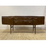 A mid century high gloss dressing table, fitted with two cupboards and two graduated drawers, raised