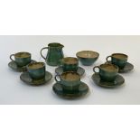 A Yellend pottery jun glazed coffee service, comprising six demitasse cups with saucers, a milk