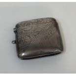 A Birmingham 1900 silver engine turned decorated shaped vesta case with engraved initials JCR, (