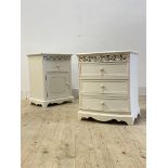 A matched pair of white painted bedside tables, each with open floral fret carved frieze, one with