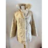 A blond mink lady's fur jacket with collar and slash pockets, belt to back, (L: 78cm, shoulder to