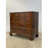A George III mahogany bow front chest, fitted with two short and three long graduated and boxwood