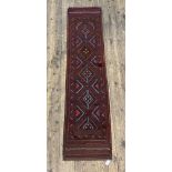 A Meshwani runner rug of typical design, 252cm x 60cm