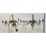 A pair of Dutch style brass chandeliers, the central column issuing eight scrolling branches D85cm