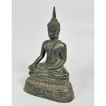 A cast bronze Asian Buddha figure with flaming knop, seated on lotus leaf cast base, with one hand