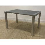 Kristalia, a contemporary Italian table, the silvered glass top raised on brushed aluminium square