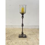 A Wrought metal and moulded glass floor standing candle stick H76cm