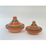 A modern graduated pair of Moroccan style tagines with orange and green decoration. (small h- 17cm