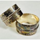 A pair of Irish Dublin 1945 silver napkin rings with Celtic style banded and beaded border, (h: 2.