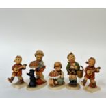 A group of five Hummel figures comprising a pair of "Happiness" figures (restoration made to