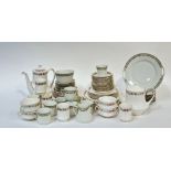 A Paragon China Belinda pattern part dinner service comprising a tea pot, coffee pot, six bowls,