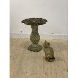 A reconstituted stone bird bath, on a spiral turned cast baluster base (H66cm) together with a