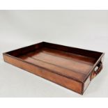 An OKA rectangular brown hide covered tray with woven leather handles to side, (h: 5cm x 38.5cm