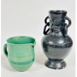 A handmade pottery ribbed green glazed 1930s style jug with C scroll handle to side, (h: 14cm x