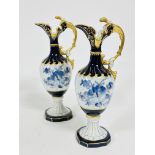 A pair of Czechoslovakian porcelain style ewers with shaped spouts and C scroll handle to side,