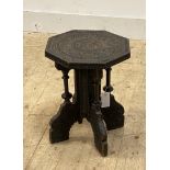 An early 20th century Anglo-Indian ebonised table, the octagonal top over turned pilasters and