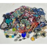A large collection of costume jewellery including bead necklaces, a lapis oval bead necklace, an