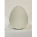 A contemporary table light, the opelescant glass shade of egg form H42cm