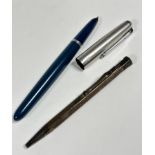 A Parker stainless steel capped fountain pen with teal blue faceted case and a London silver
