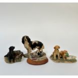 A group of Border Fine Arts models comprising, a dog and cat in a basket "Tired out", a labrador