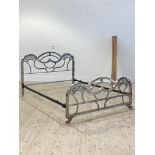 An Art Deco period chromed metal 4' double bed frame, complete with side irons and later pine base