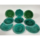 A pair of Wedgwood green circular vine leaf moulded plates with basket weave borders, (d: 20.5cm)