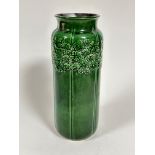 A West German mid century style pottery vase with embossed floral border with green glazed signed