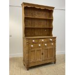 A 19th century and later pine dresser, the associated two height plate rack over base fitted with