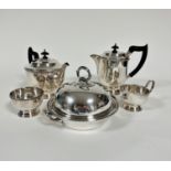An Epns four piece tea and coffee service of cylinder form including teapot, coffee jug with black