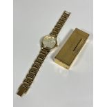 A ladies Accurist yellow metal and stainless steel wristwatch with silver dial and baton hour