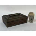 A Huntley and Palmers biscuit tin emulating Indian carved wood with design of elephants and