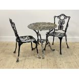 A cast aluminium garden table (H68cm x 66cm) and two matching chairs