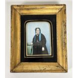 A 19thc overpainted photograph of a lady with blue ribbon in her hair, in glazed mounted frame, (8cm