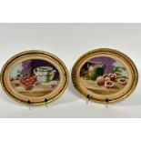 A pair of late 19thc petit point oval panels, one with cherries and two handled vase, the other with