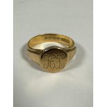 A 22ct gold signet ring with circular panel to front with engraved initials HL, (Z1) (8.26g)