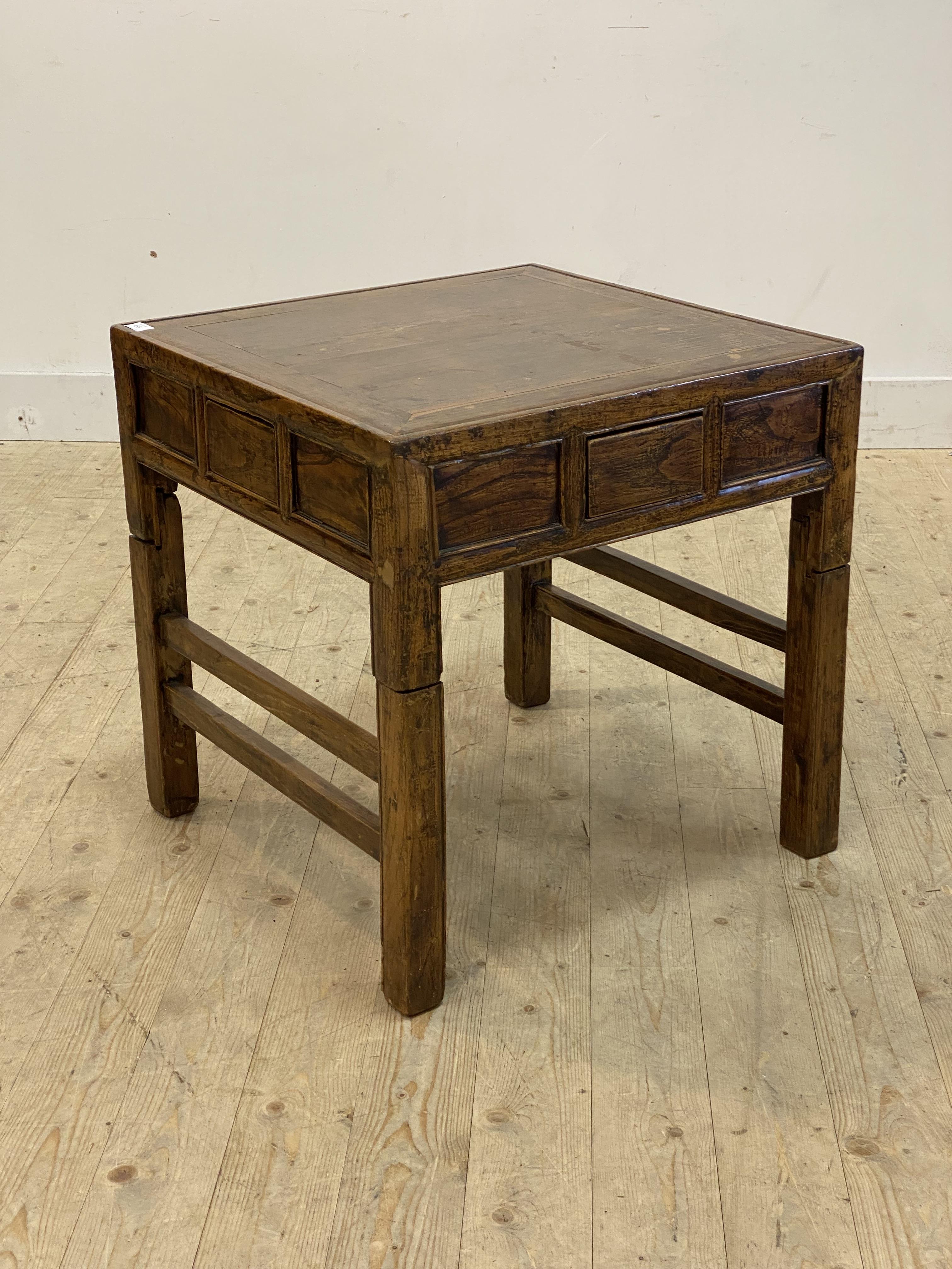 A late Qing Dynasty Chinese elm Mahjong or games table, the panelled top over drawer to each side,