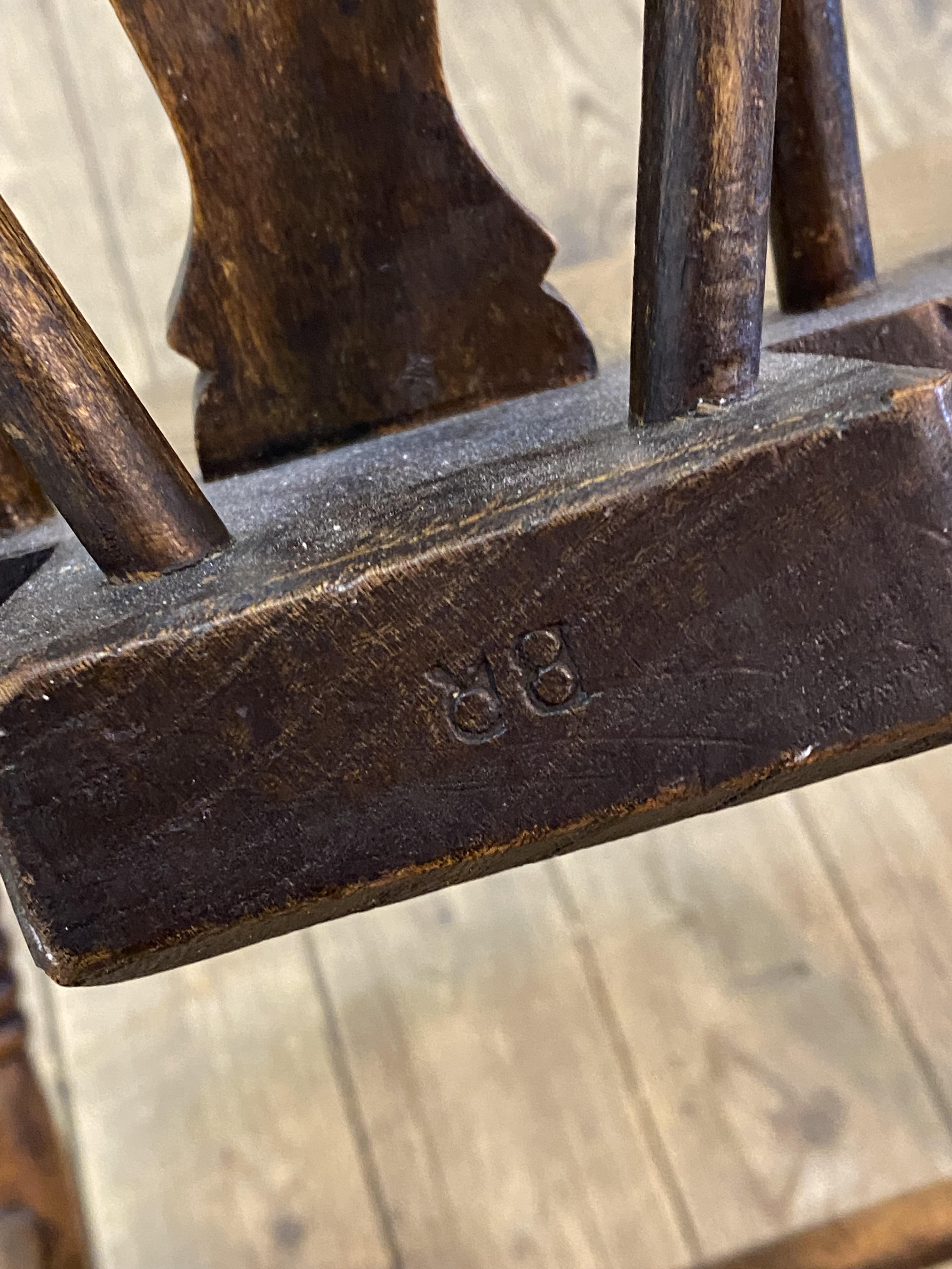 A set of six 19th century elm and ash Windsor dining chairs, hoop spindle and splat carved wheel - Image 2 of 2