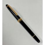 A Mont Blanc black cased and gilt mounted fountain pen, model 4810, with 14ct gold mounted nib,