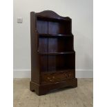 A 20th century three tier waterfall open bookcase with drawer to base, H110cm, W65cm, D28cm