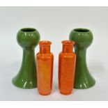 A pair of art pottery Wardle bud vases decorated with olive green enamelling (h- 19.5cm) and a