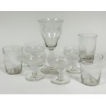 A set of four vine leaf and fruit thumb cut and engraved cocktail glasses on baluster stems and