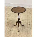 An Edwardian inlaid mahogany wine table, the circular top over ring turned and reeded column on