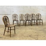 A set of six 19th century elm and ash Windsor dining chairs, hoop spindle and splat carved wheel