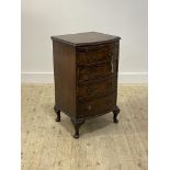 A George II style burr walnut bow front chest, with brushing slide over four drawers, raised on