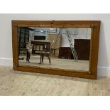 An early 20thc pitch pine mirror with simulated bamboo to frame (formerly a wardrobe door) 142cm x