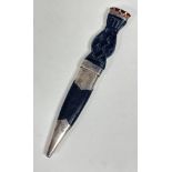 A white metal gentleman's sgian-dubh with ebony carved platted handle with white metal mounted