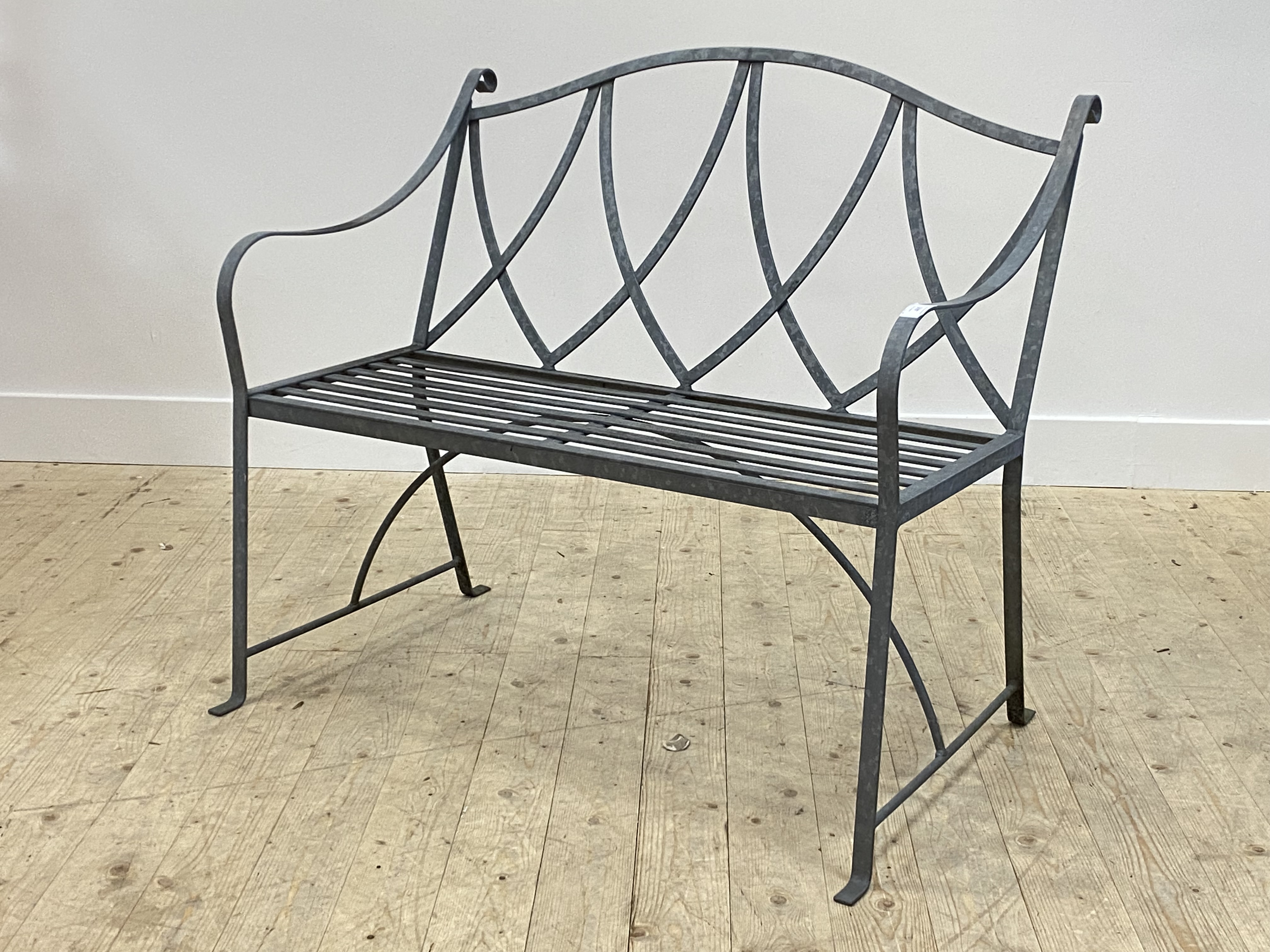 A galvanised wrought metal two seat garden bench H87cm, W105cm, D67cm