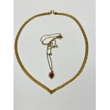 A 9ct gold engraved V link necklace (L: 15cm) and a 9ct gold mounted pink stone pendant on 9ct